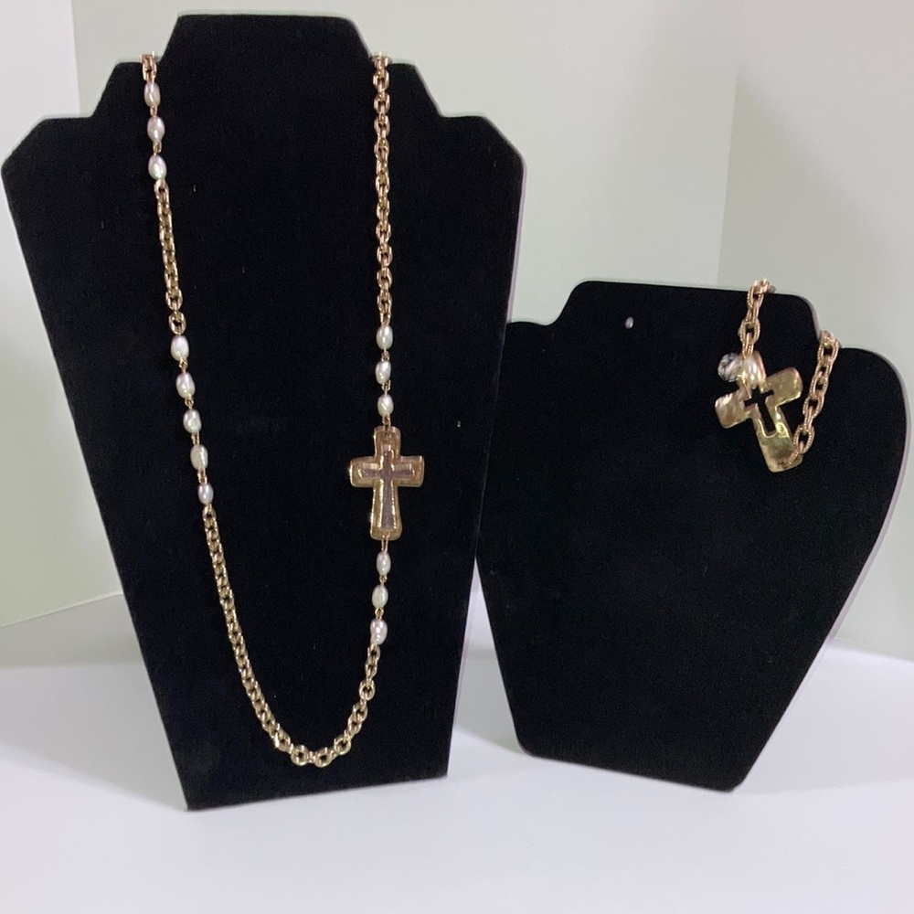 Stylish gold tone cross bracelet and necklace set.
